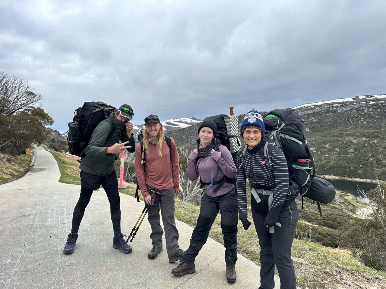 Walkers on an alpine trail in summer